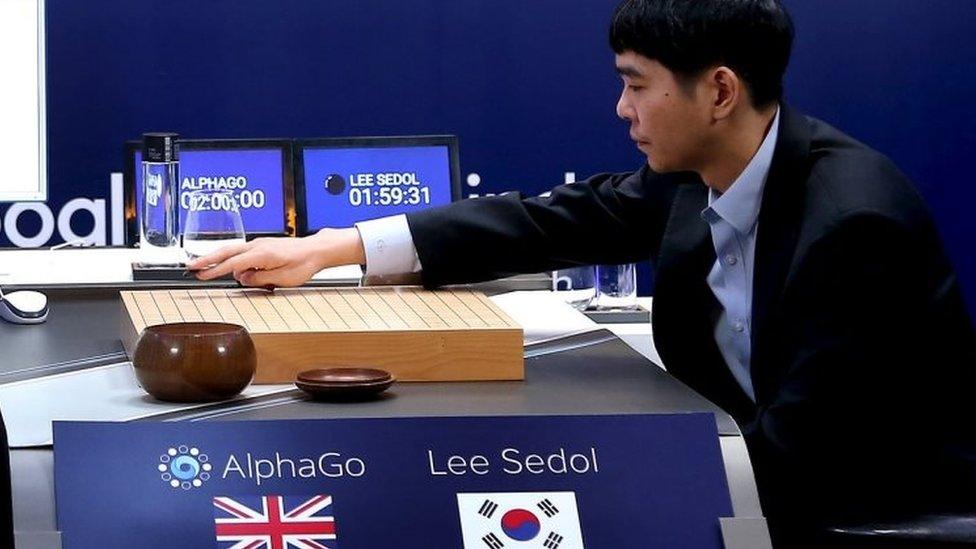 Go player Lee Sedol puts the first stone against Google's AlphaGo