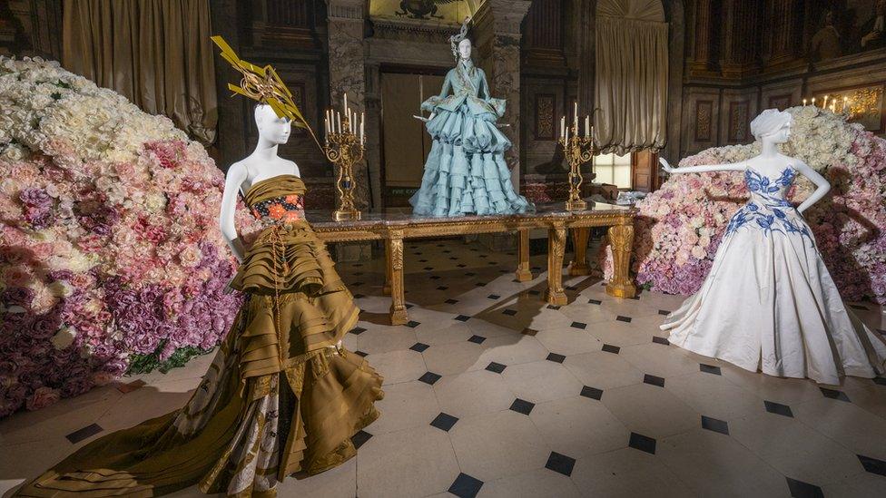 Three mannequins wearing dresses