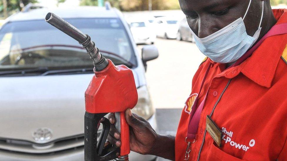 A fuel station attendant in Nairobi