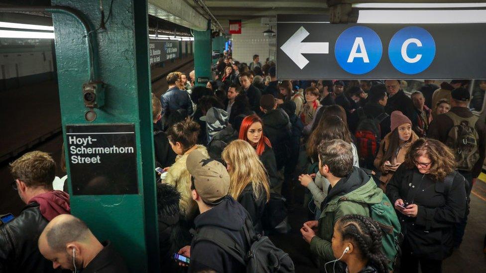 Commuters waiting for a train at the Hoyt - Schermerhorn station