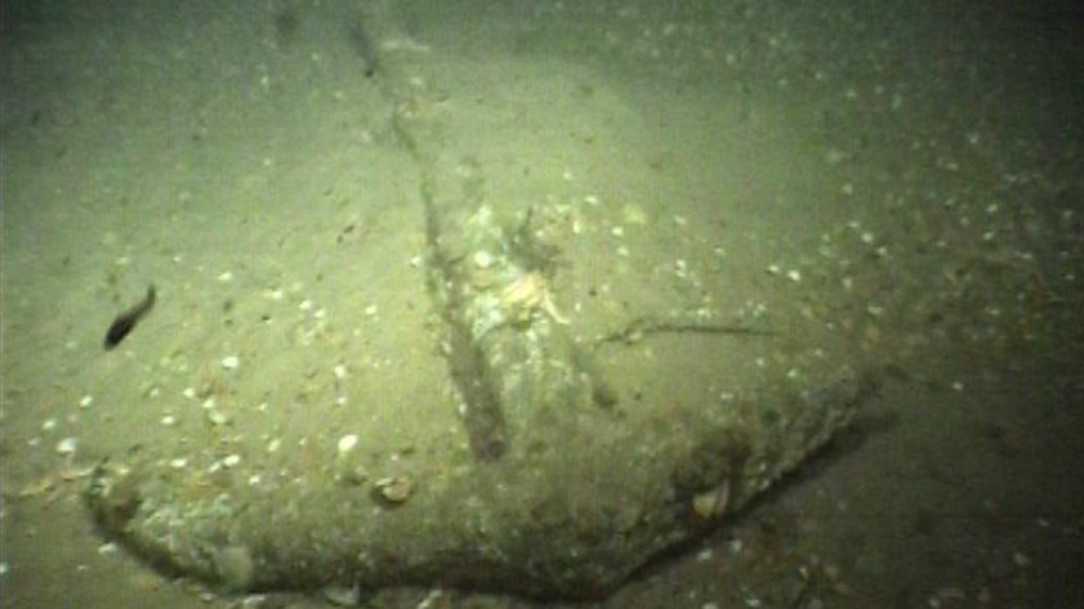 Wrought iron anchor on the sea bed