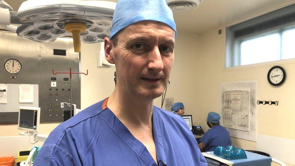 A head and shoulders shot of surgeon Serryth Colbert in a hospital operating theatre