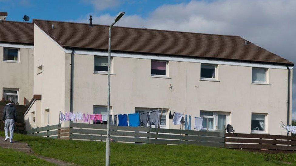 Housing with clothes drying on a washing line