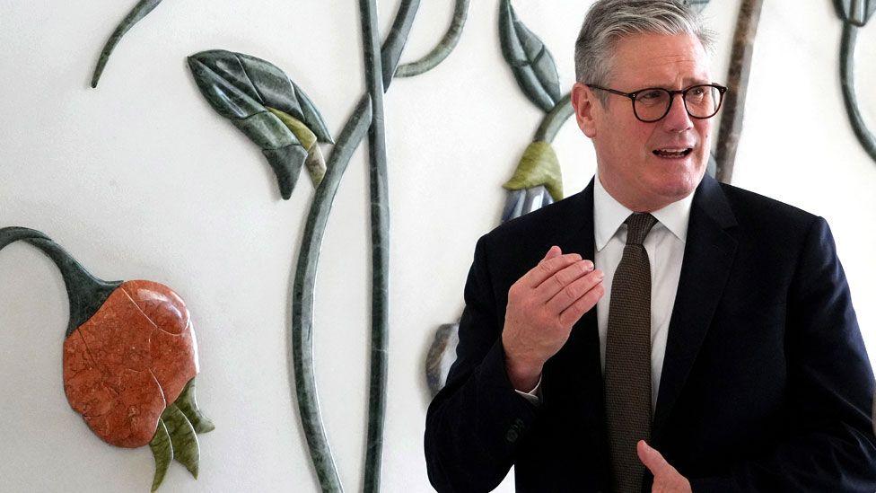 Britain's Prime Minister Keir Starmer visits the Sheikh Zayed Grand Mosque in Abu Dhabi, United Arab Emirates, on 9 December 2024