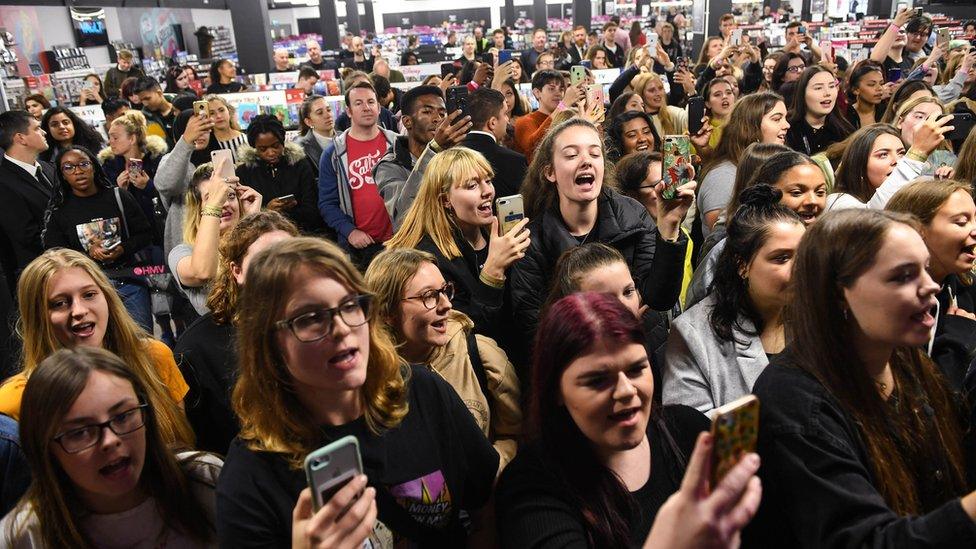 Crowds watch Liam Payne perform at the launch event of the HMV Vault in Birmingham,