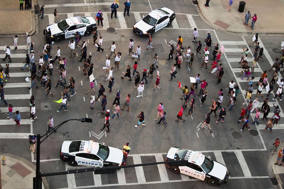 Protesters march during a Black Lives Matter rally in downtown Dallas, Texas - 7 July 2016