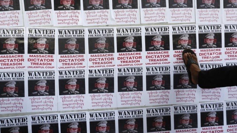 Mock "wanted" posters show the leader of Myanmar's military