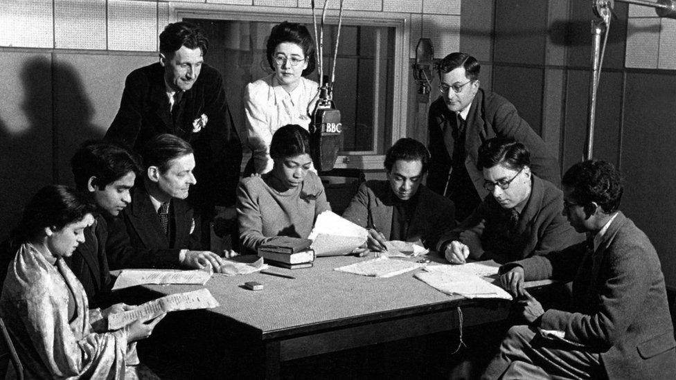 Una Marson amongst colleagues including T.S. Eliot and George Orwell looking over her shoulder