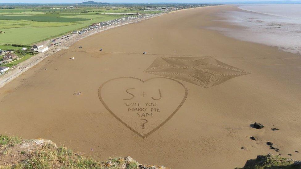 wide view of beach with love-heart and geometrical pattern