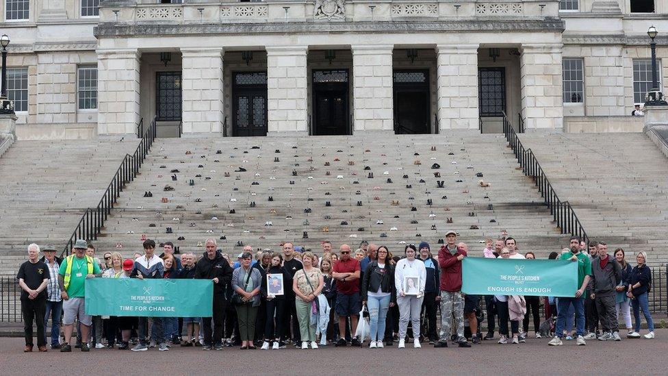 Demonstration at Stormont with shoes lining the steps