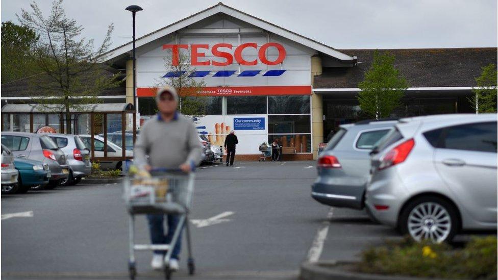 Shopper outside Tesco