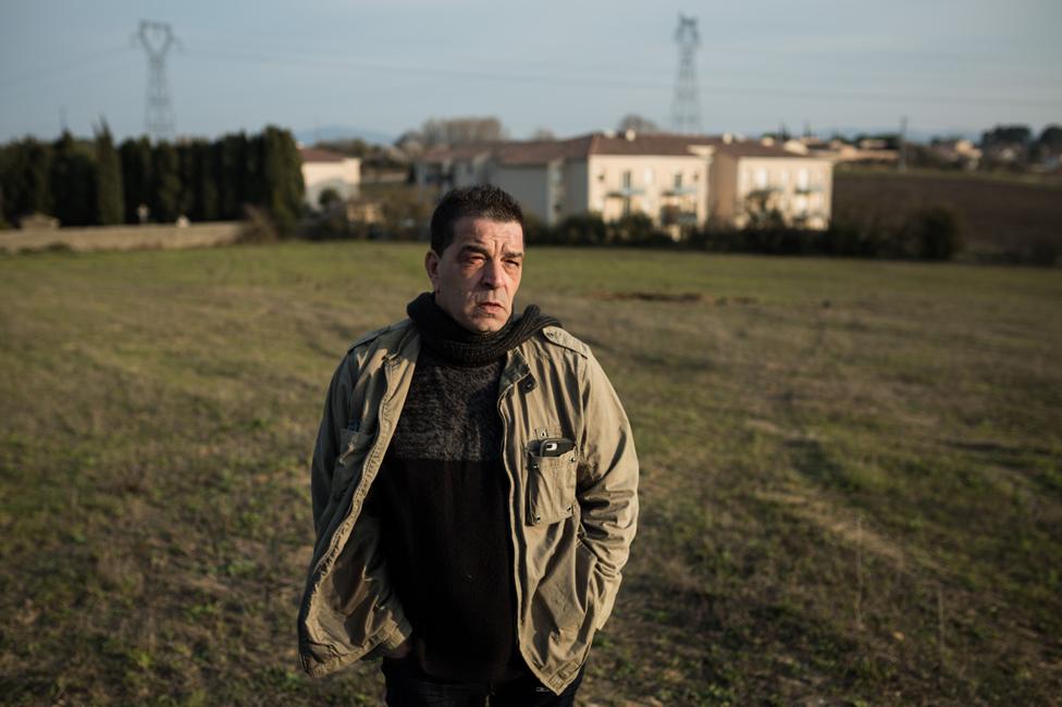 Michel Soules in the field where new houses are being built for the Gypsy community