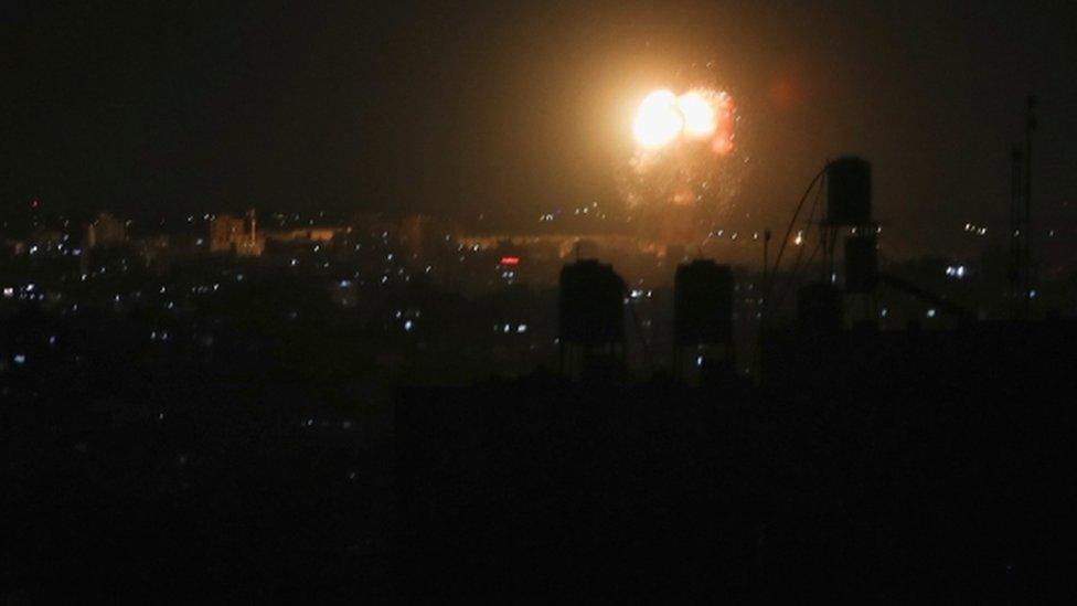 Smoke and flames are seen after an Israeli air strike in the northern Gaza Strip