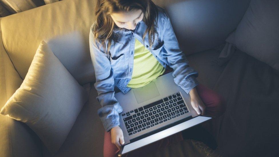 A child using a laptop