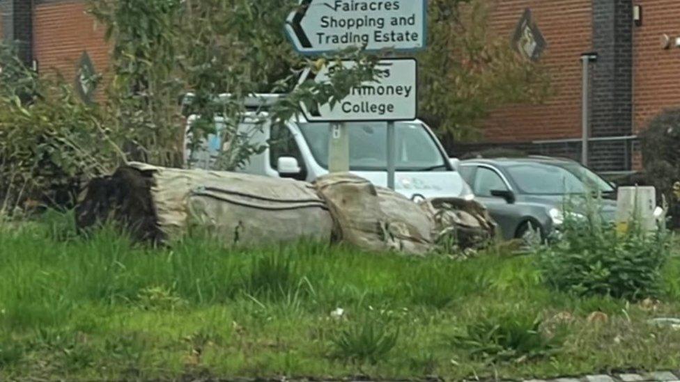 Fallen Abingdon monk statue