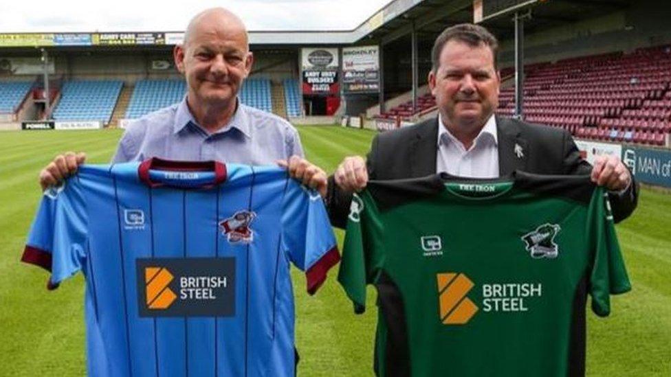 Paul McBean and Peter Swann with the new Scunthorpe United football kit