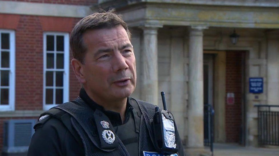 Nick Adderley with short dark hair in police uniform at Wootton Hall