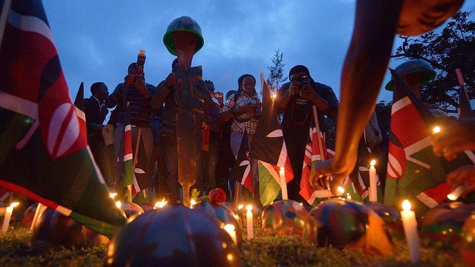 Candles and Kenyan flag at vigil for Kenyan soldiers killed in the El Adde attack in 2015.