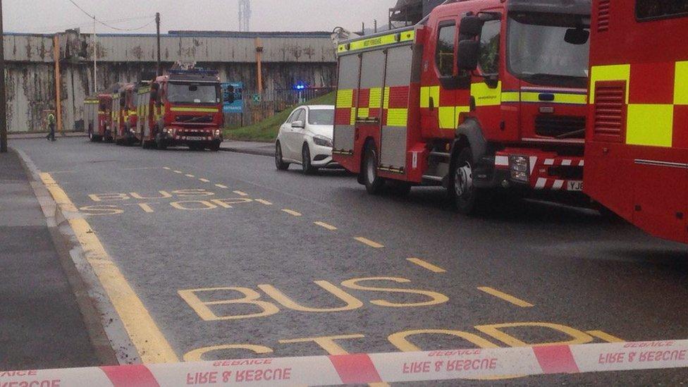 Fire engines driving down a road
