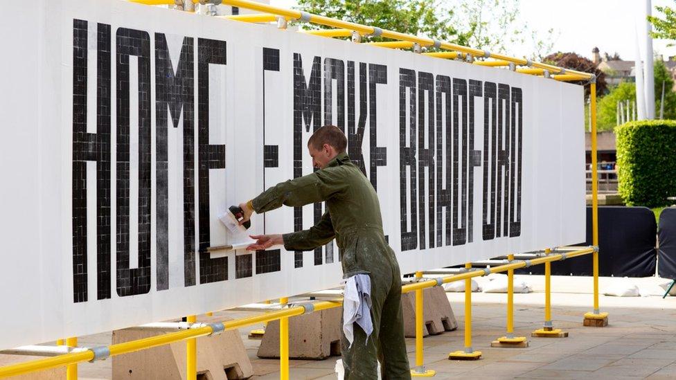 Oli Bentley assembling the signs