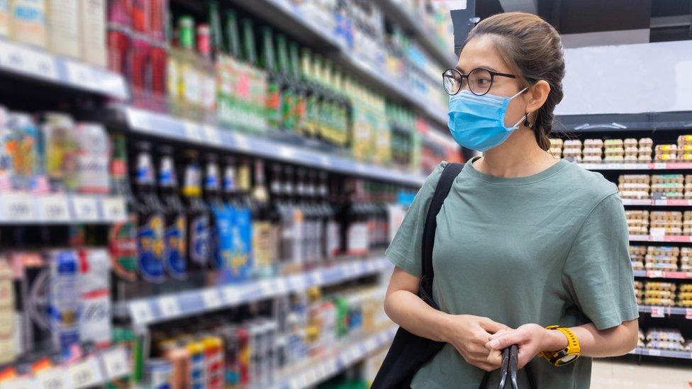 Woman shopping for alcohol