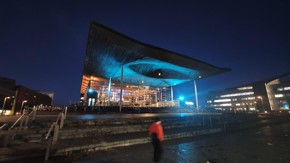 The Senedd lit up in the Ukrainian colours yellow and blue