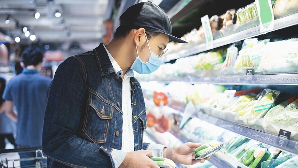 Man shopping with mask on