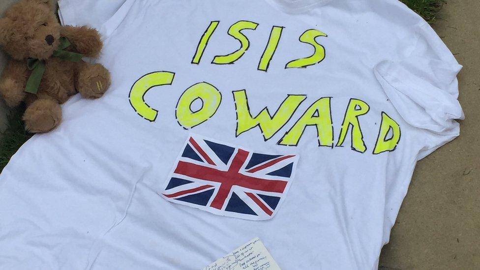 T-shirt reading ISIS coward