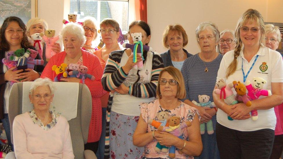 Pontyclun’s Yarnmongers knitting group handing trauma teddies to the Welsh Ambulance Service