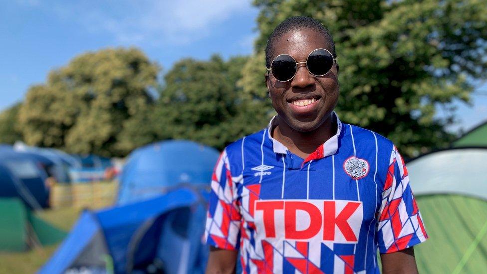 Rudi Obasi-Adams in an Ajax shirt at Latitude Festival