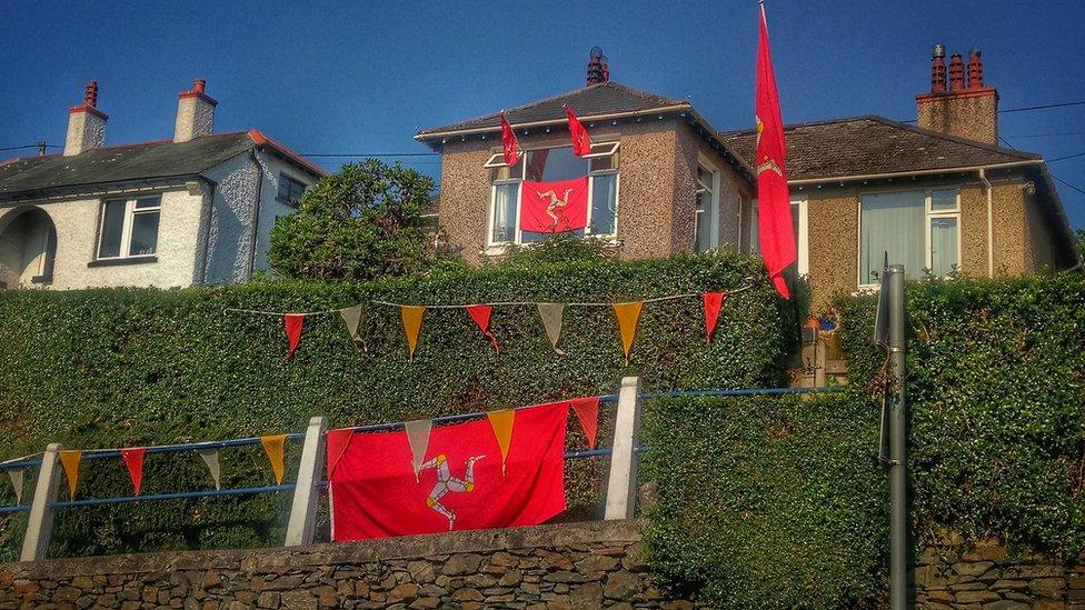 Manx Flags outside houses on Tynwald Day 2018