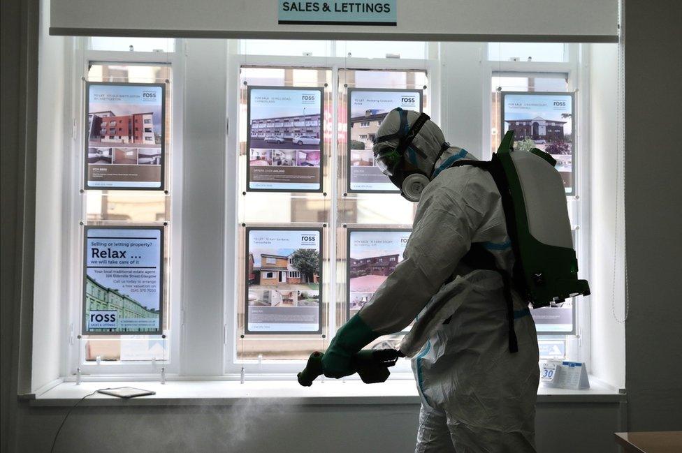 Estate agent's office being cleaned