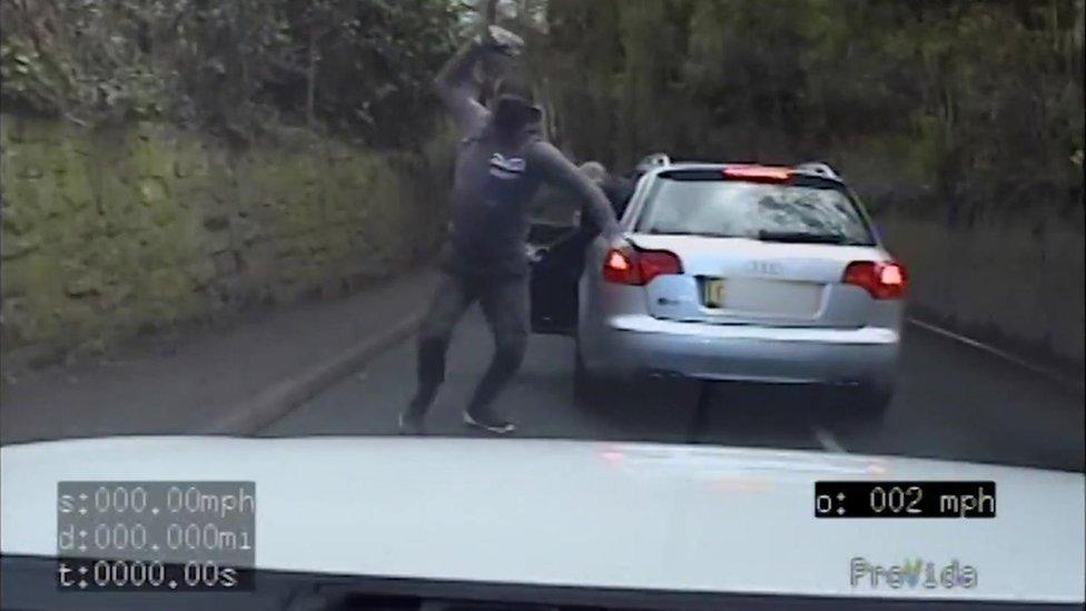 Offender throws a stone at a police officer's car