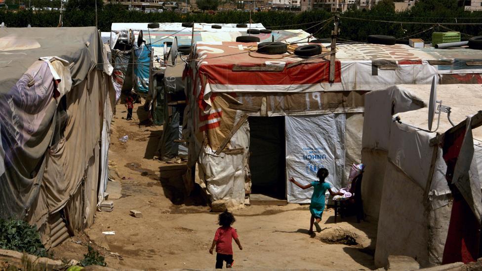 Syrian children play in a makeshift refugee camp in Lebanon's Bekaa Valley, June 20, 2016