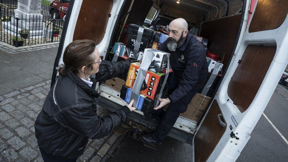 Staff from County Durham and Darlington Fire and Rescue Service unloading support parcels