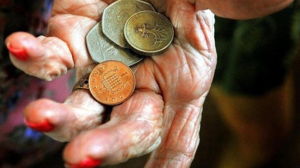 Older woman holding money