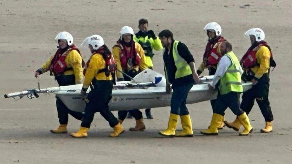 boat and RNLI crew on the beach