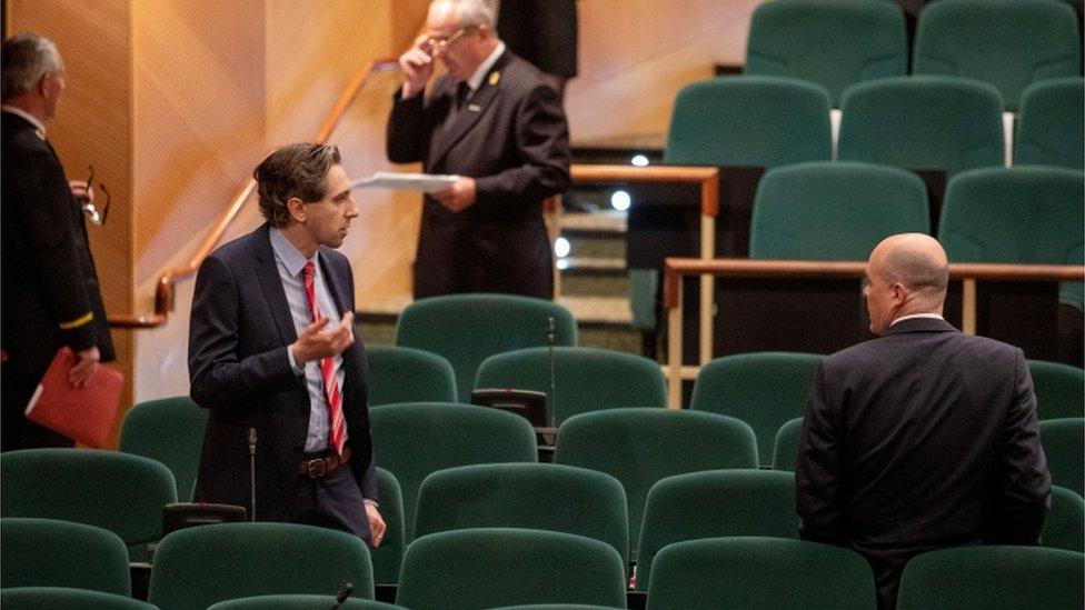 Higher Education Minister Simon Harris (centre left), during the 33rd sitting of the new Dail in the Convention Centre, Dublin