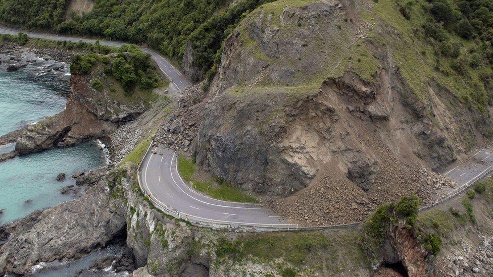 A landslide covers a section of state highway 1 near Kaikoura, New Zealand, Monday, Nov. 14, 2016, after a powerful earthquake