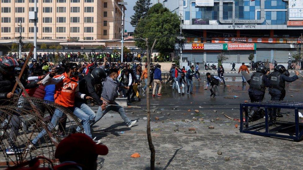 Demonstrators hurl stones at police