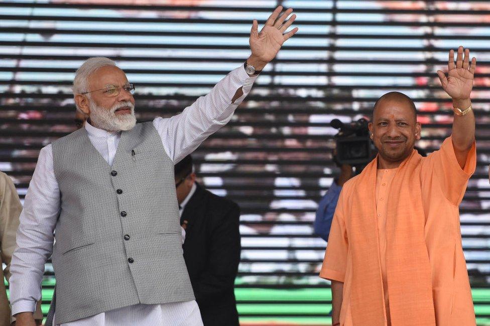 Narendra Modi (L) and Yogi Adityanath