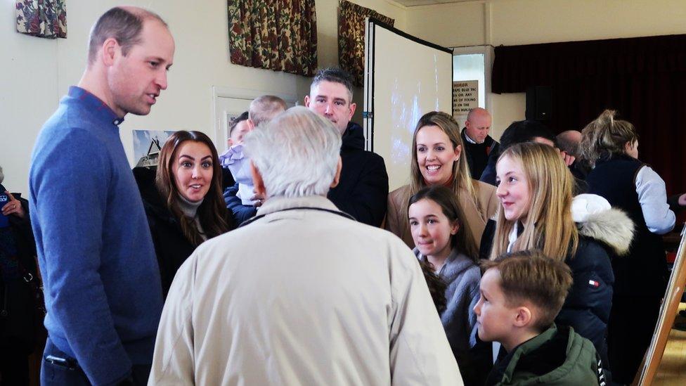 Prince William talking to members of the public