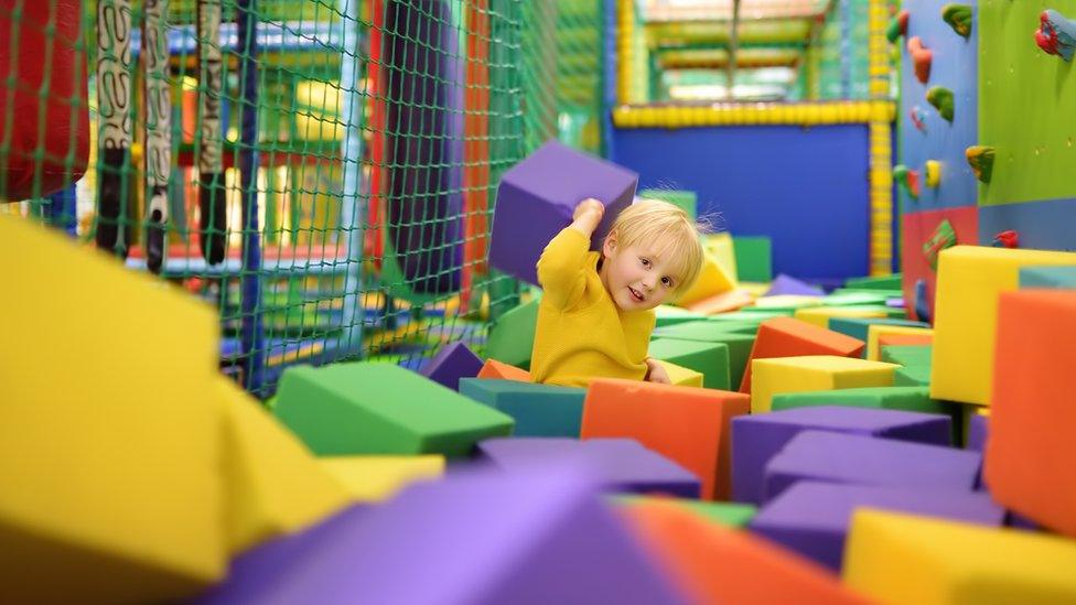 Boy playing in soft play venue (stock photo)