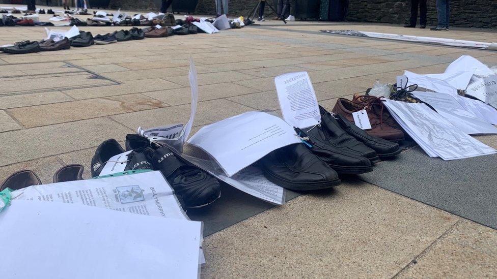 Shoes spelling out the word 'no' at Guildhall Square in Derry