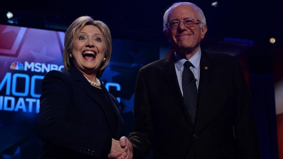 US Democratic presidential candidates Hillary Clinton and Bernie Sanders shake hands before participating in the MSNBC Democratic Candidates Debate at the University of New Hampshire in Durham