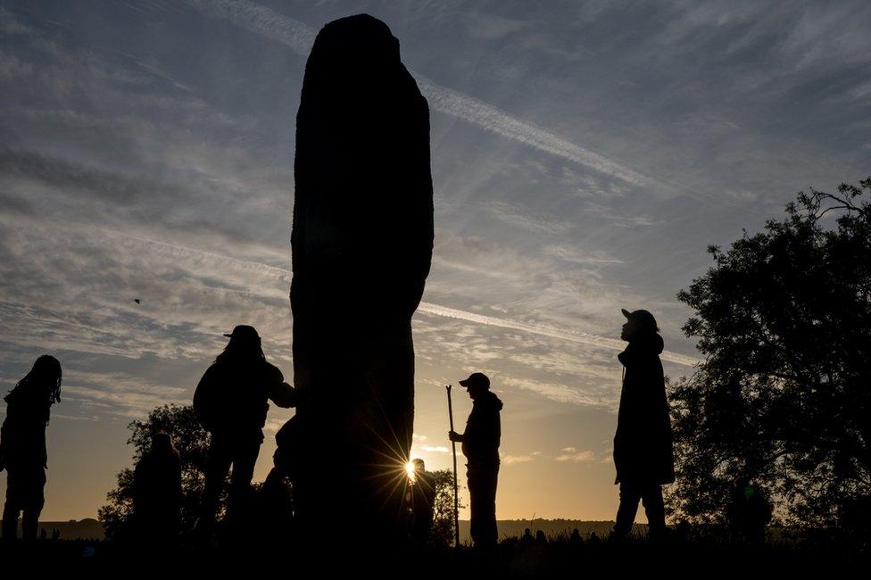 Silhouetted Avebury stone