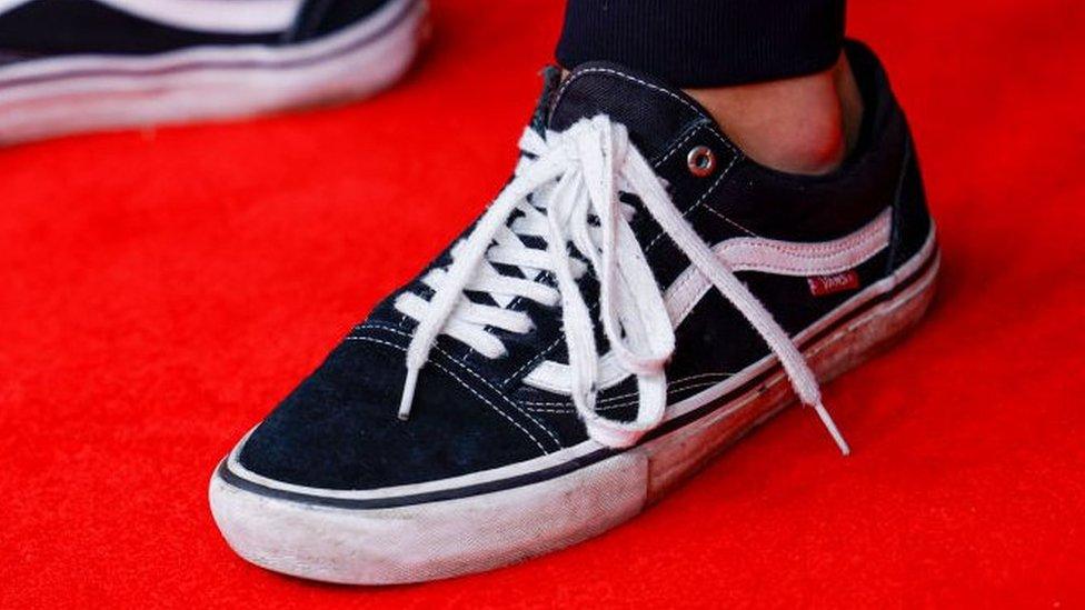 A pair of Vans shoes