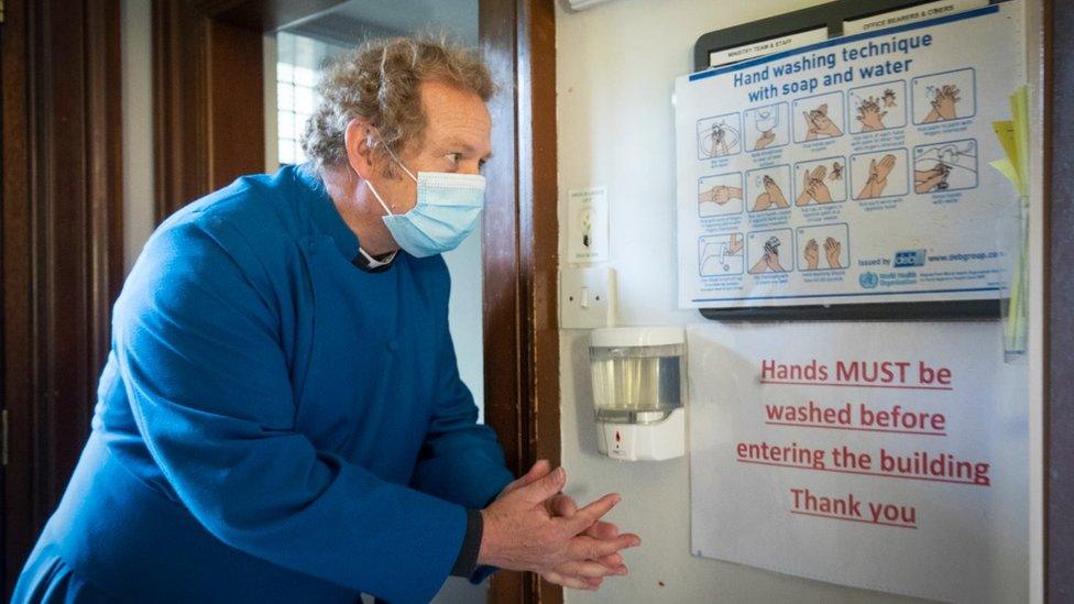 Rev Peter Sutton washes his hands before making preparations to allow space for private prayer in the Memorial Chapel at St Cuthbert's