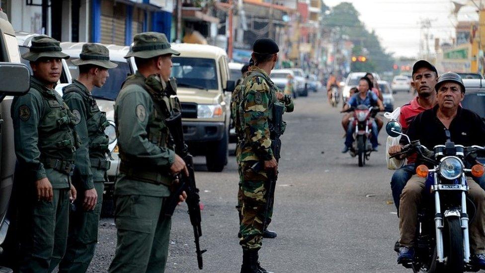 Venezuela"s National Guard soldiers patrol the streets of La Fria, Tachira state, Venezuela on December 18, 2016 to prevent further riots.