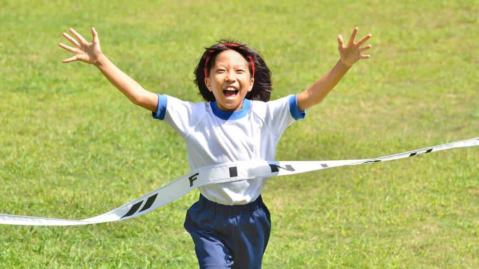 girl-crossing-the-finish-line